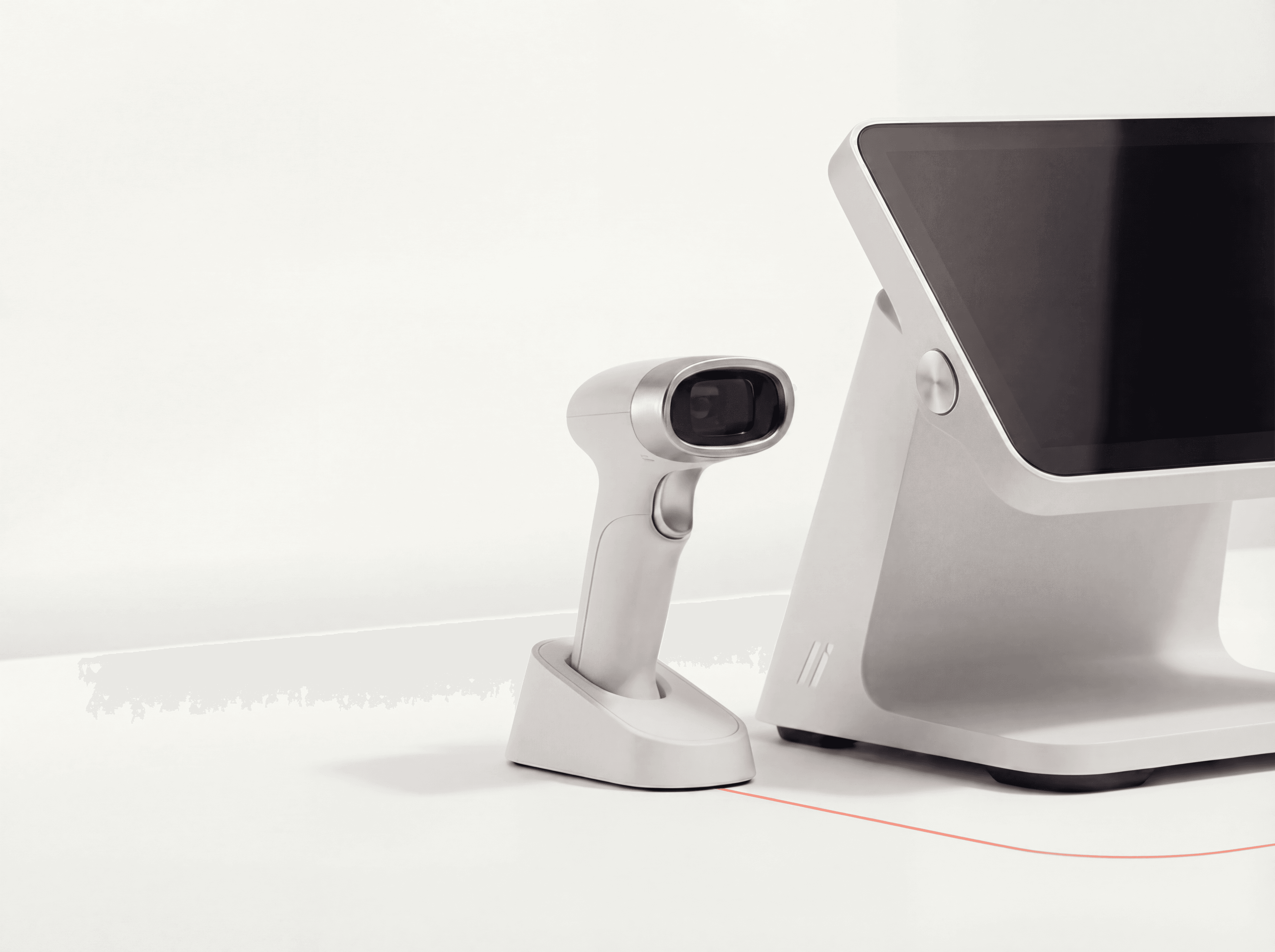 Incline POS terminal and barcode scanner on a countertop